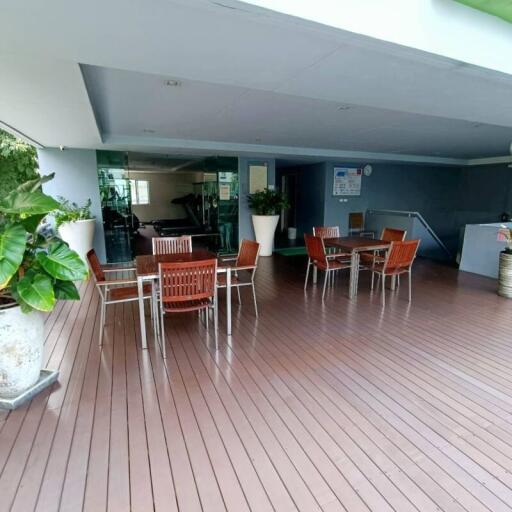 Spacious covered patio area with seating and modern amenities