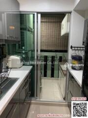 Compact modern kitchen with glass partition
