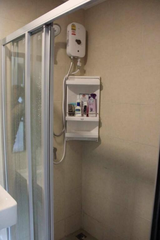 Compact bathroom with shower and water heater