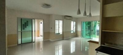 Spacious and well-lit living room with garden view