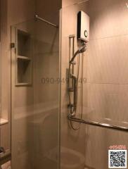 Modern bathroom interior with glass shower and wall-mounted water heater