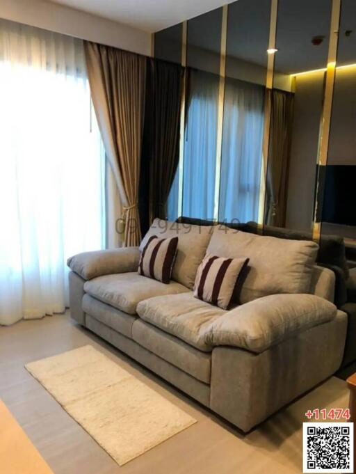 Cozy and modern living room with plush sofa and stylish curtains