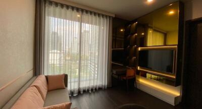 Modern living room with large windows and custom shelving