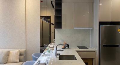 Modern kitchen with integrated appliances and breakfast bar