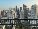 City skyline view from high-rise apartment balcony