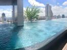 Luxurious rooftop swimming pool with city skyline view