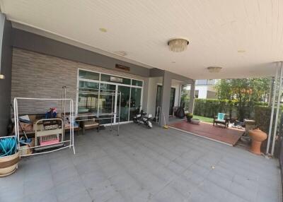 Spacious covered patio area with various amenities and seating arrangements