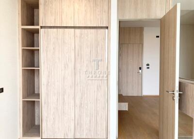 Modern bedroom with built-in wooden wardrobes