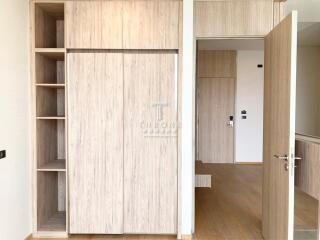 Modern bedroom with built-in wooden wardrobes