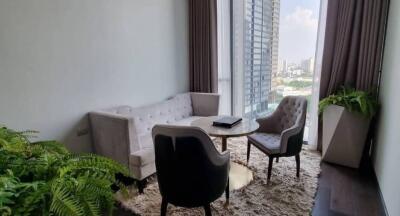 Modern and stylish living room with abundant natural light and city views