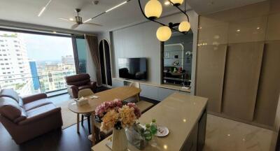 Modern living room with dining area and city view