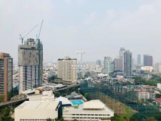 High-rise urban skyline with construction and residential buildings