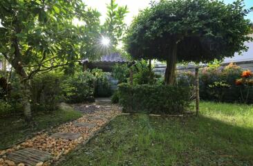 Peaceful garden pathway leading to a charming gazebo