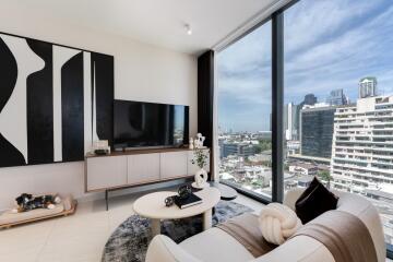 Modern apartment living room with large windows and city view