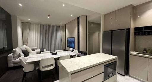 Modern kitchen with integrated dining and living area