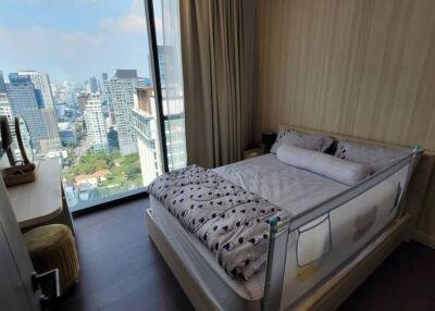 Modern bedroom with city view and natural lighting