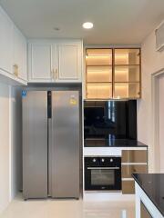 Modern kitchen with stainless steel appliances and white cabinetry