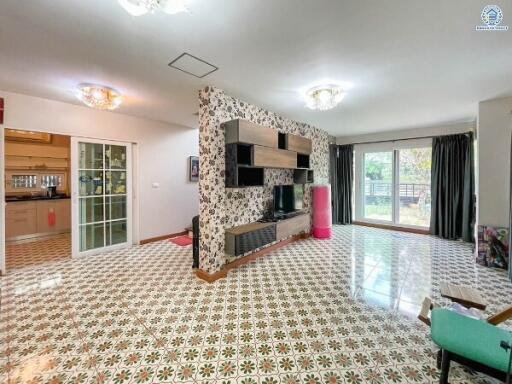 Spacious living room with decorative tiled flooring and modern fireplace