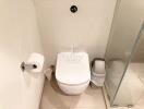 Modern bathroom with white ceramic toilet and sleek design