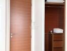 Modern bedroom with open wooden wardrobe