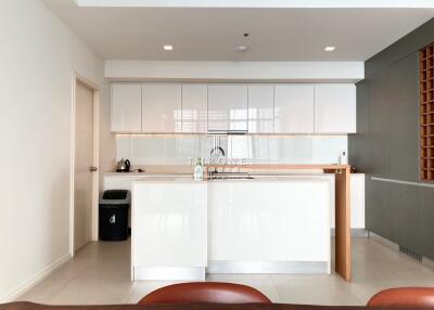 Modern kitchen with white cabinets and breakfast bar in a new apartment