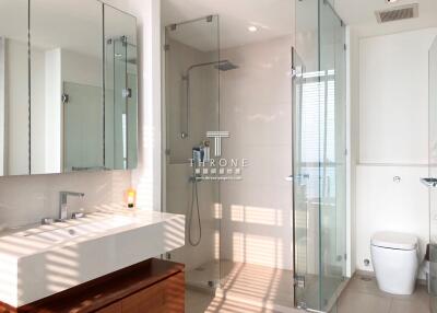Spacious and modern bathroom with double vanity and glass shower