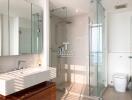 Spacious and modern bathroom with double vanity and glass shower