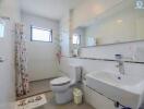 Spacious bathroom with modern amenities and natural lighting