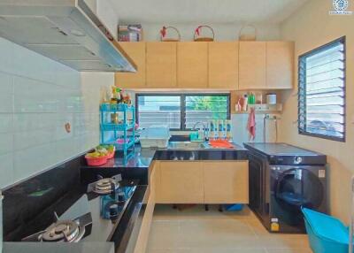 Modern kitchen with well-organized cabinets and updated appliances