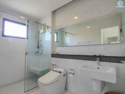 Modern bathroom with large mirror and glass shower