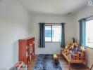 Bright bedroom with religious shrine and contemporary furniture