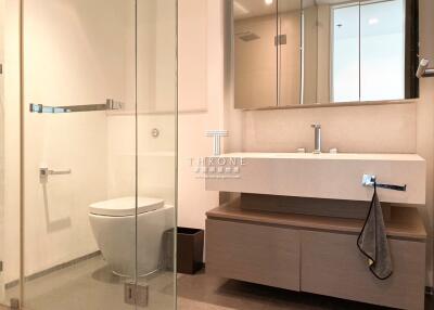 Modern bathroom with glass shower and streamlined vanity