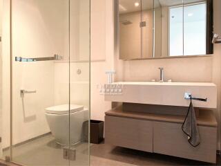 Modern bathroom with glass shower and streamlined vanity