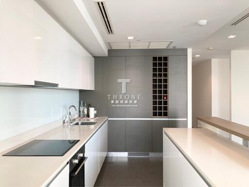 Modern, sleek kitchen with integrated appliances and ample storage