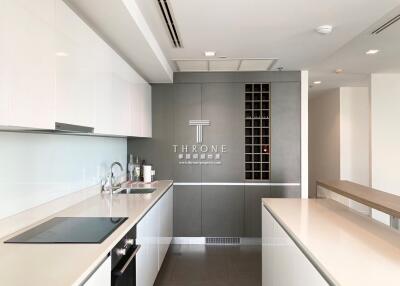 Modern, sleek kitchen with integrated appliances and ample storage