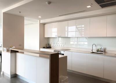 Modern spacious kitchen with clean design and ample lighting