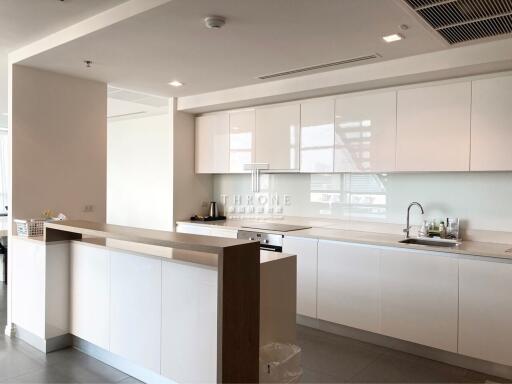 Modern spacious kitchen with clean design and ample lighting