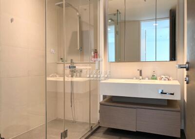 Modern bathroom with glass shower and double vanity