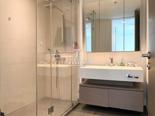 Modern bathroom with glass shower and double vanity