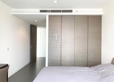 Spacious bedroom with modern design and large wardrobe