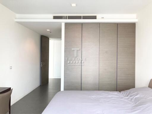 Spacious bedroom with modern design and large wardrobe