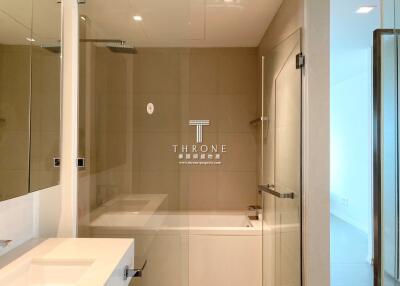 Modern bathroom with spacious glass shower and elegant decor