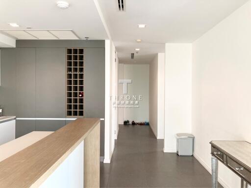 Modern kitchen with integrated living space in contemporary apartment