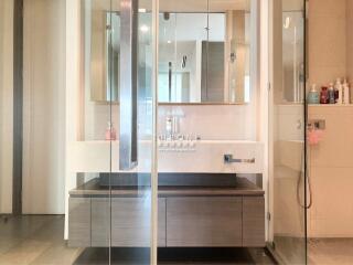 Modern bathroom with walk-in shower and sleek vanity unit