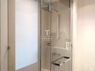 Modern bathroom interior with glass shower and elegant design