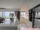 Spacious modern living room with open kitchen layout featuring stylish decor and appliances