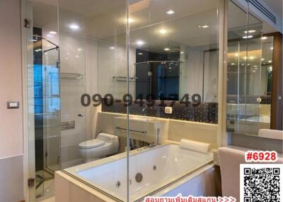 Elegant bathroom with large bathtub and glass shower enclosure