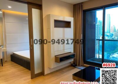 Modern bedroom with city view and built-in entertainment unit