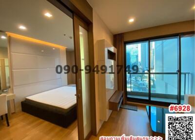 Modern bedroom with large windows and city view