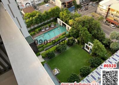 aerial view of apartment complex with pool and garden